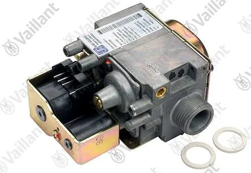 Vaillant Gasarmatur mit mehreren Anschlüssen und zwei Dichtungen im Vordergrund. Metallisches Gehäuse und eine Beschriftung an der Oberseite sind sichtbar.